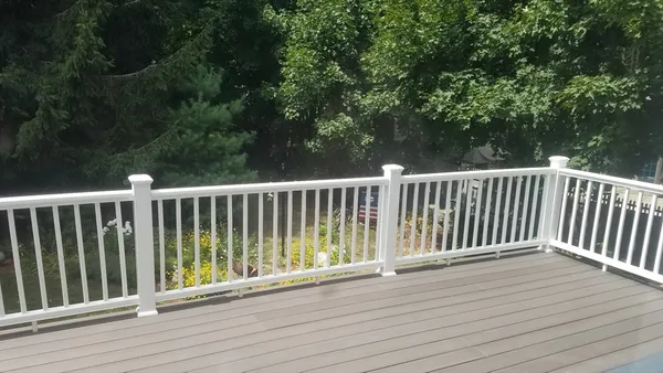 a view of balcony with wooden floor