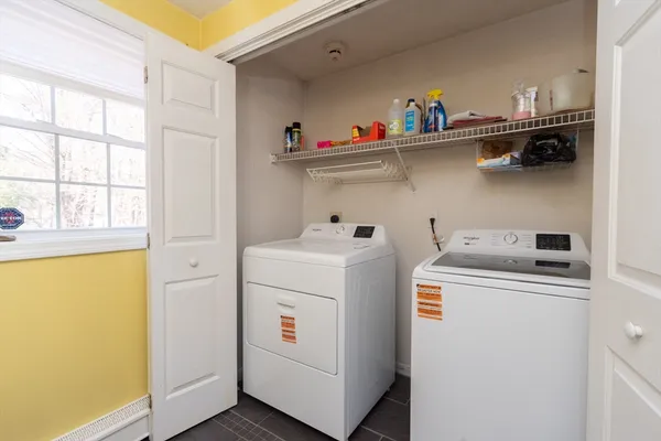a utility room with dryer and washer