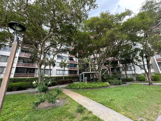 front view of a building with a yard