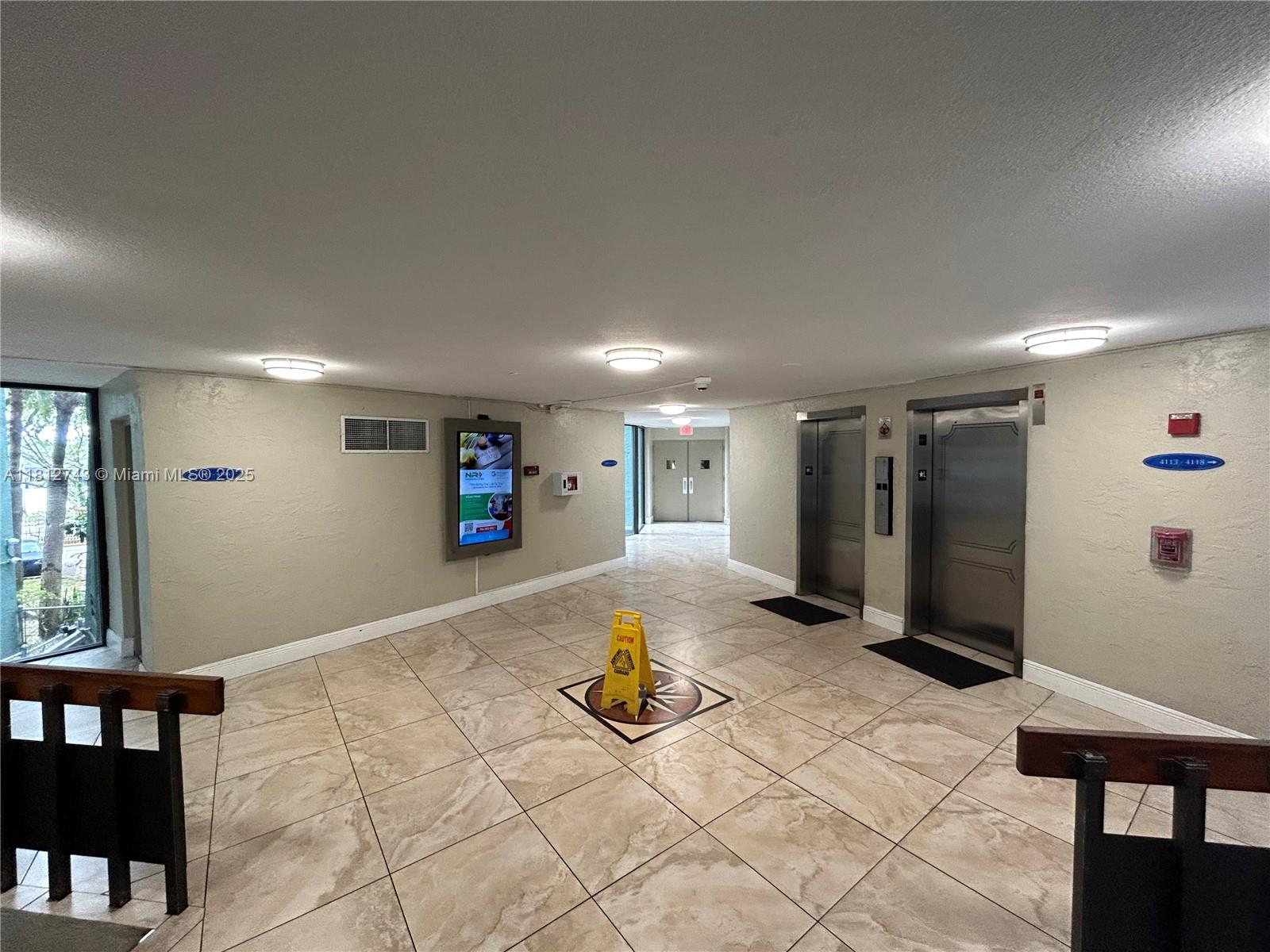 4222 Inverrary Boulevard, Unit 4211 Lauderhill, FL 33319 - Photo 17 of 18 a view of a livingroom with furniture and windows
