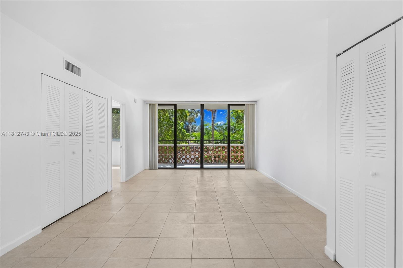 4222 Inverrary Boulevard, Unit 4211 Lauderhill, FL 33319 - Photo 3 of 18 a view of an empty room with a sliding door