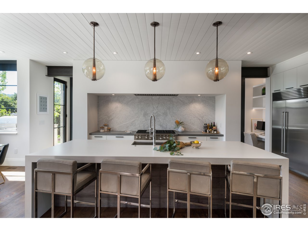 2260 Meadow Avenue Boulder, CO 80304 - Photo 11 of 26 a kitchen with a table chairs stove and cabinets