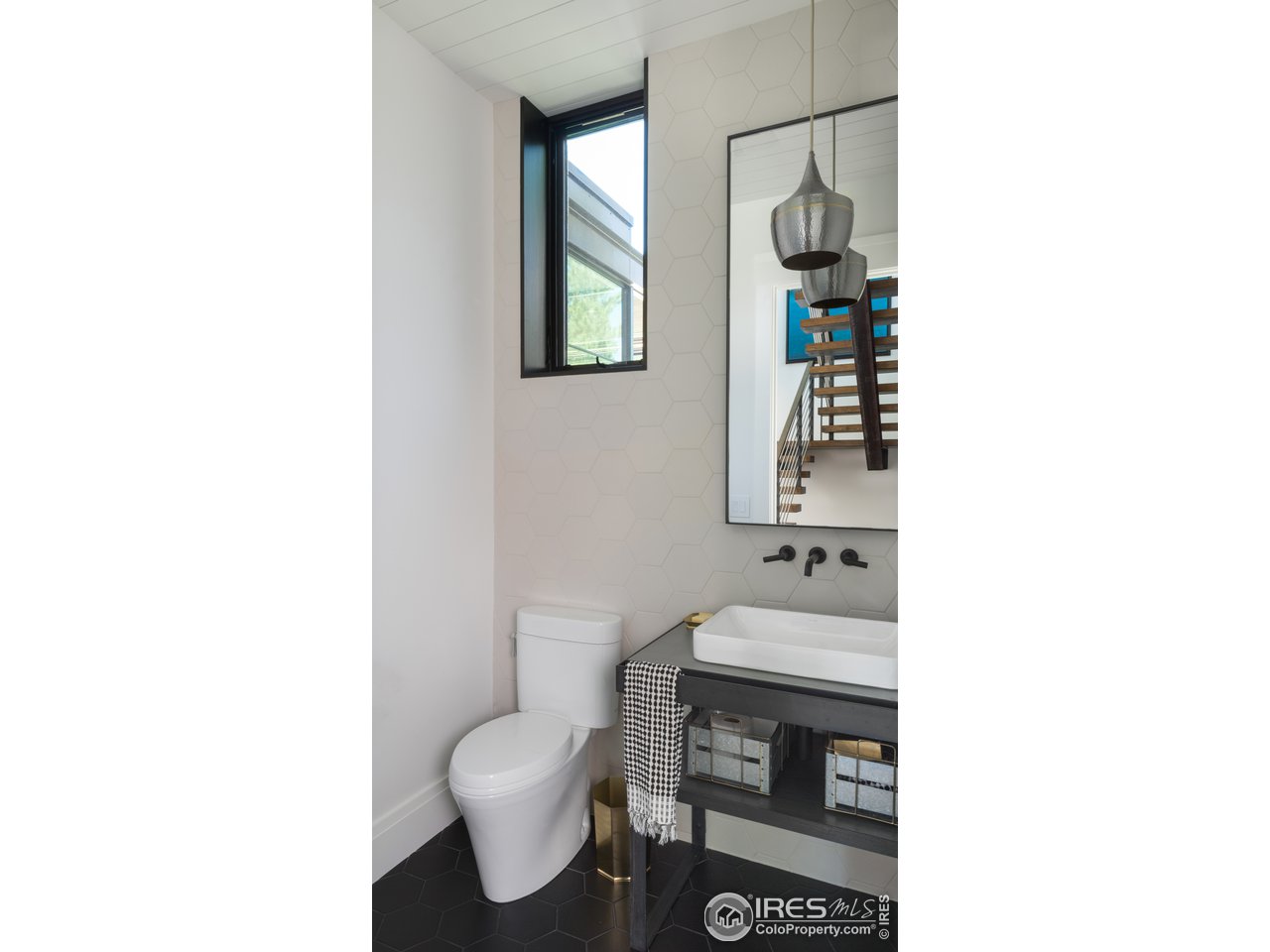 2260 Meadow Avenue Boulder, CO 80304 - Photo 18 of 26 a bathroom with a sink toilet and mirror