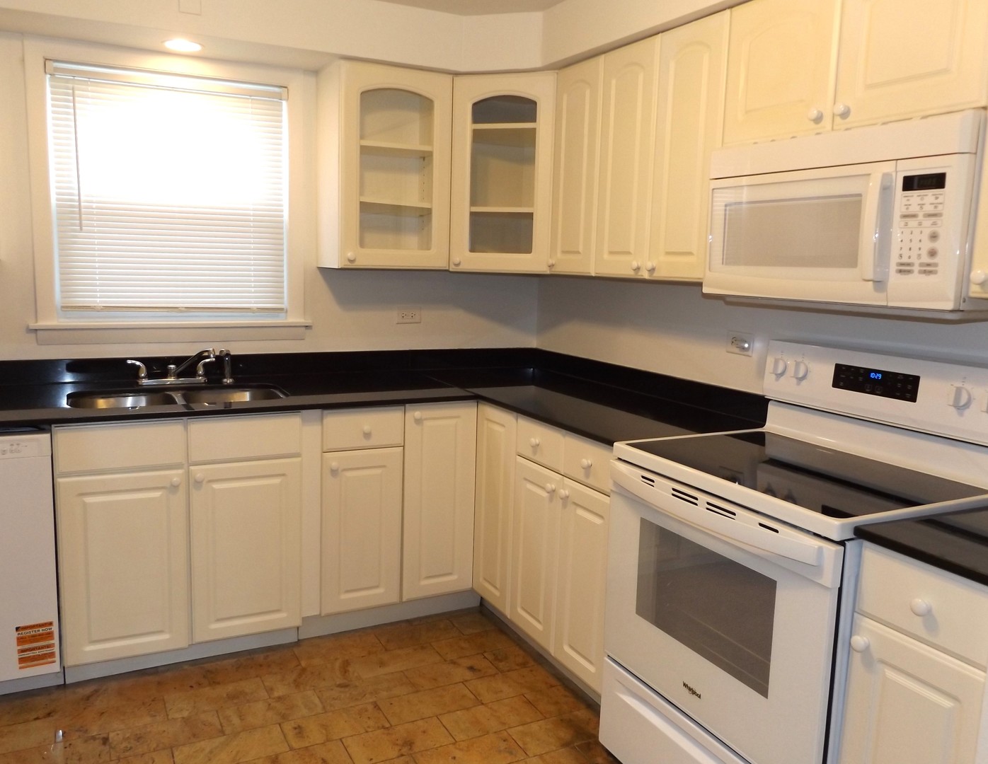 8751 West 79th Street, Unit 1 Justice, IL 60458 - Photo 20 of 32 a kitchen with a sink and cabinets