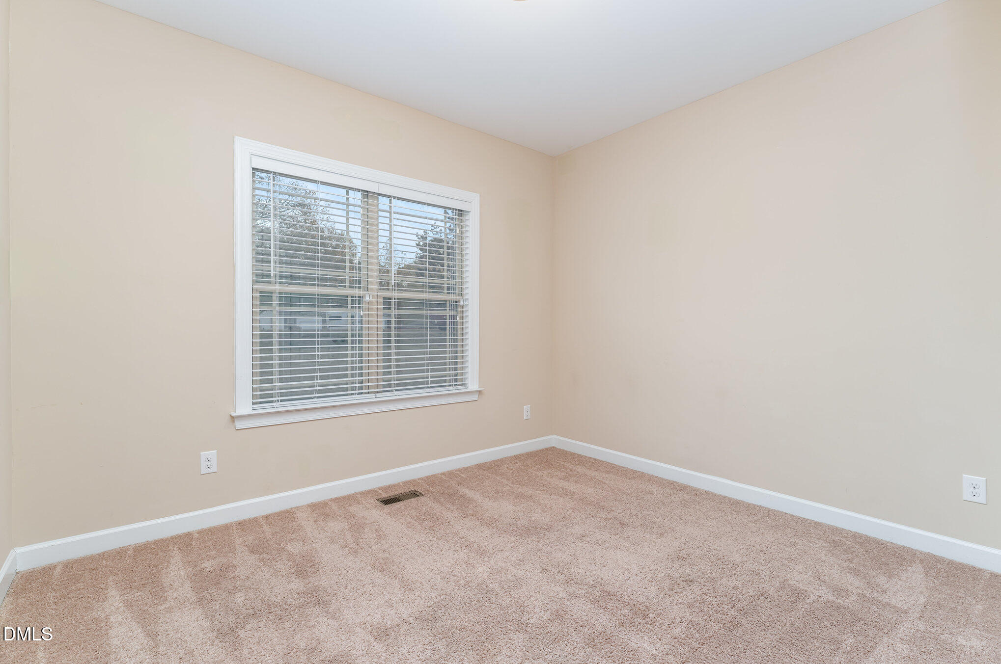 410 Penwood Road Willow Spring, NC 27592 - Photo 18 of 21 a view of an empty room with a window