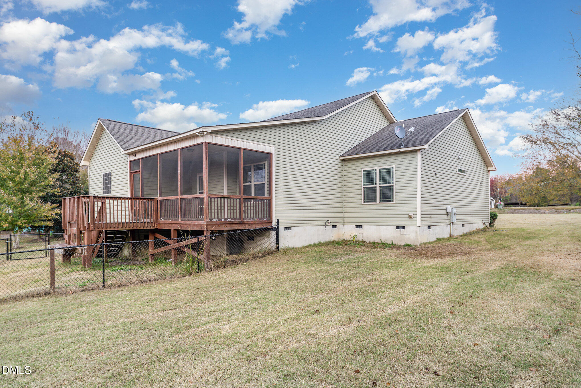 410 Penwood Road Willow Spring, NC 27592 - Photo 20 of 21 a backyard of a house with table and chairs
