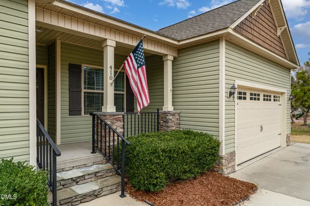 a view of front door and potted plants