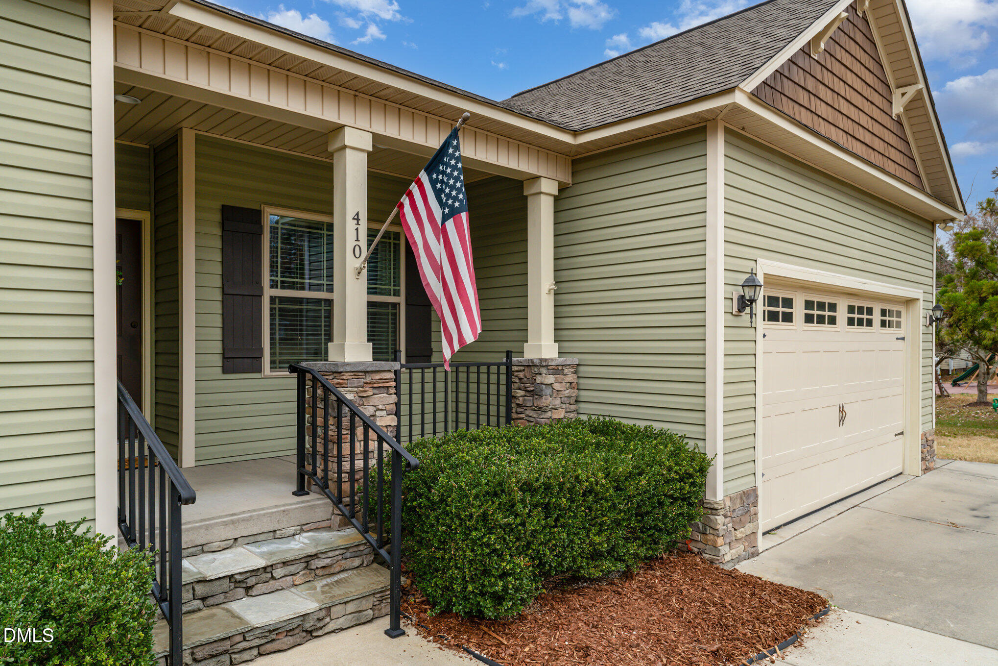 410 Penwood Road Willow Spring, NC 27592 - Photo 3 of 21 a view of front door and potted plants