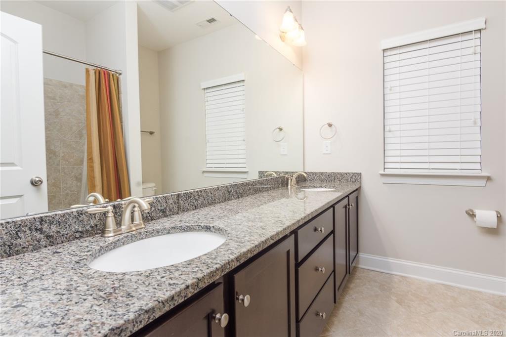 4736 Water Oak Road Charlotte, NC 28211 - Photo 23 of 45 a bathroom with a granite countertop sink and a mirror