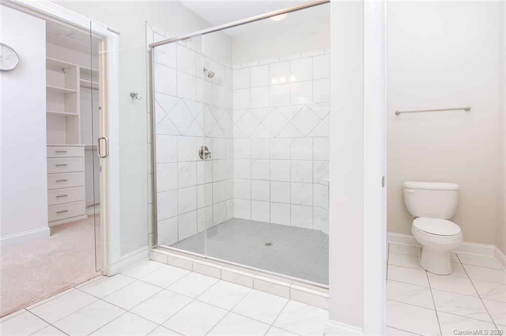 4736 Water Oak Road Charlotte, NC 28211 - Photo 25 of 45 a bathroom with a bathtub and a shower