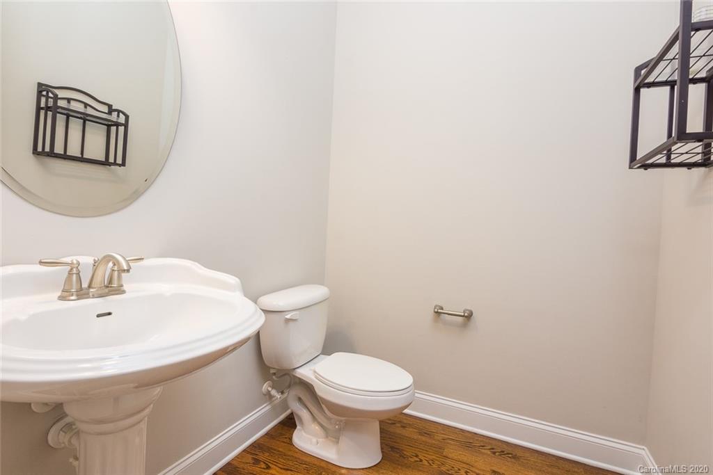 4736 Water Oak Road Charlotte, NC 28211 - Photo 33 of 45 a white toilet sitting next to a bathroom sink