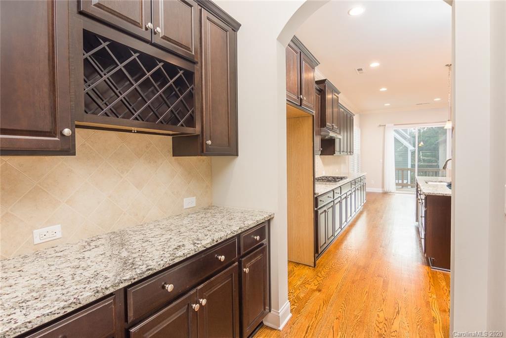 4736 Water Oak Road Charlotte, NC 28211 - Photo 5 of 45 a view of a kitchen cabinets and wooden floor
