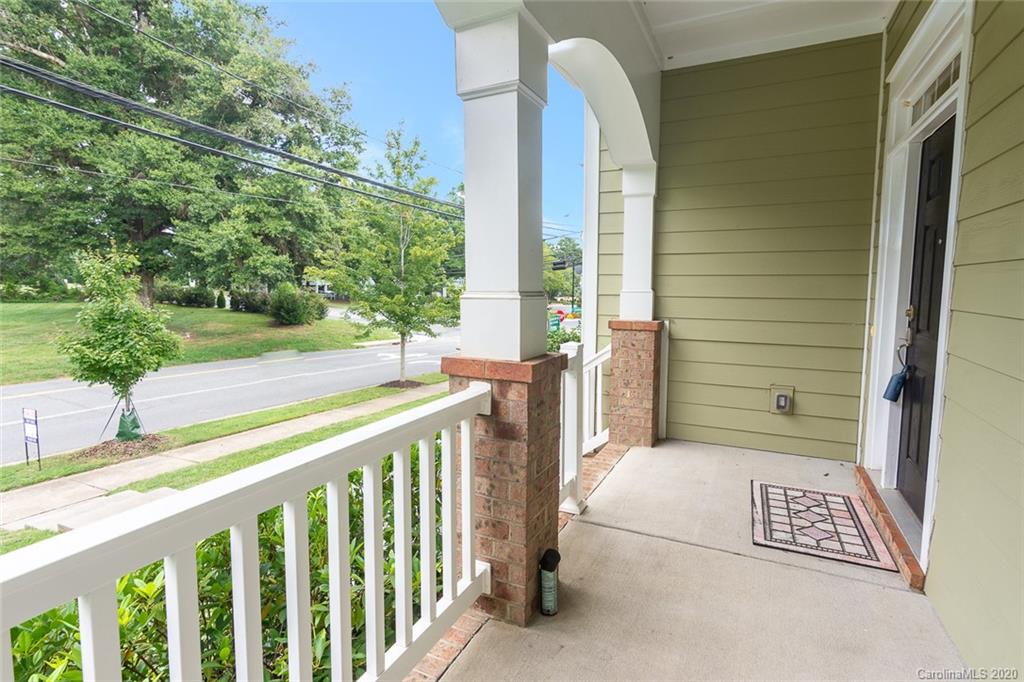 4736 Water Oak Road Charlotte, NC 28211 - Photo 42 of 45 a view of a balcony with floor to ceiling window plants and trees