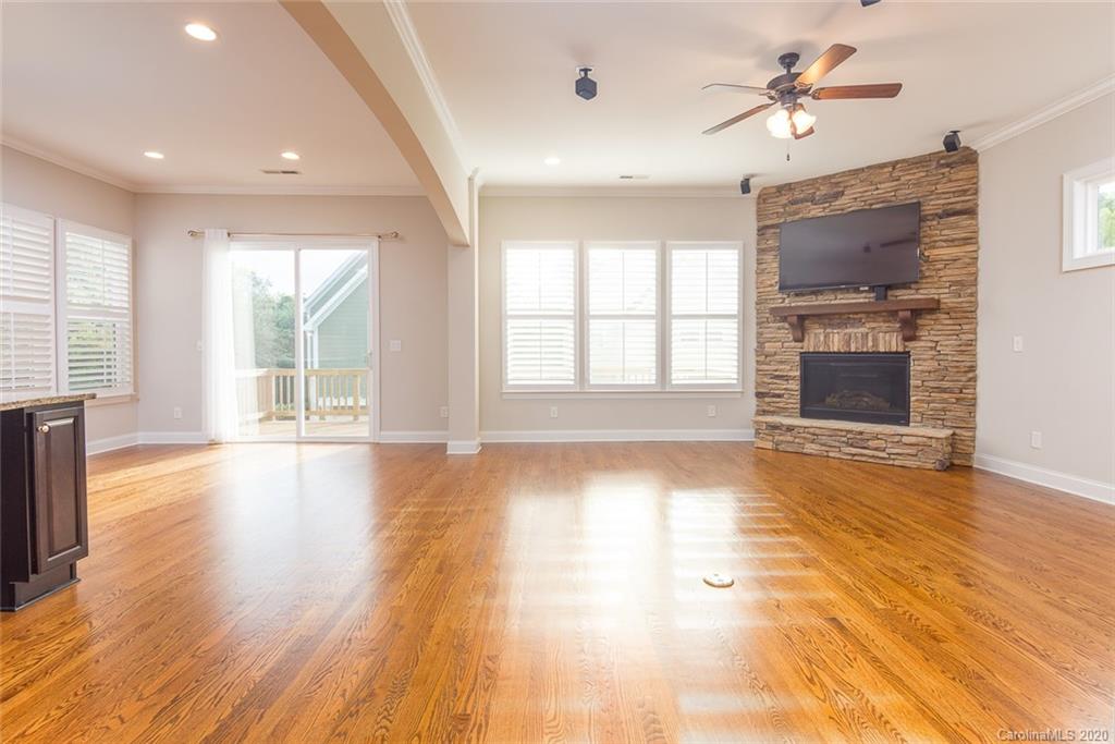 4736 Water Oak Road Charlotte, NC 28211 - Photo 8 of 45 a view of an empty room with a window and wooden floor