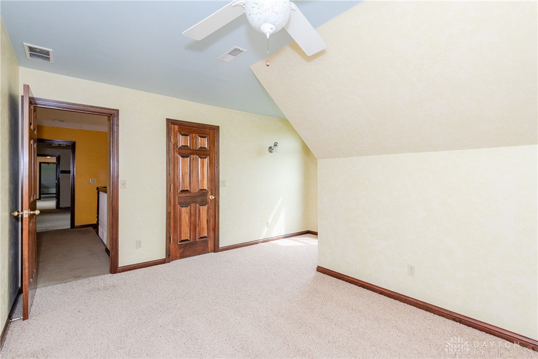 9981 Ridge Acres Lane Englewood, OH 45322 - Photo 29 of 73 This versatile room features warm tones and ample space, perfect for any need.