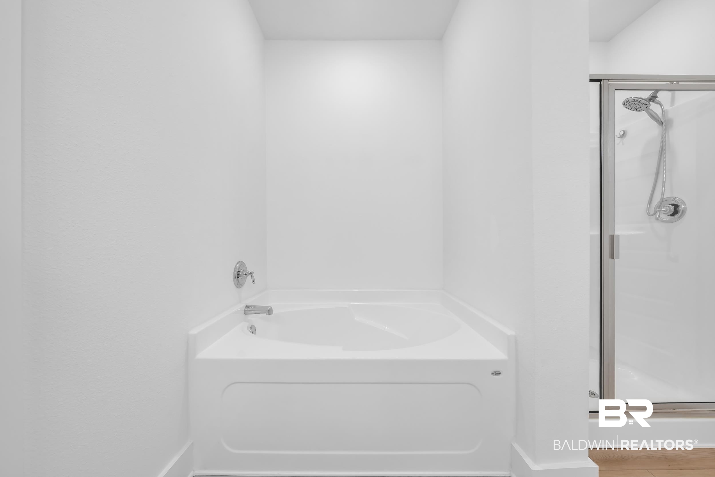 9933 Weller Cove Foley, AL 36535 - Photo 19 of 36 Soaking tub with chrome fixtures and an adjacent glass-enclosed shower
