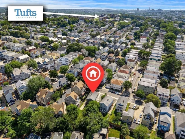 an aerial view of residential house with parking space