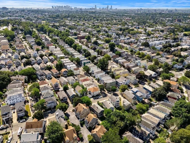 an aerial view of a city with lots of residential buildings