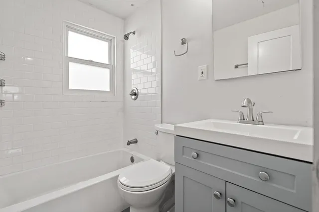 a bathroom with a sink toilet a vanity and shower