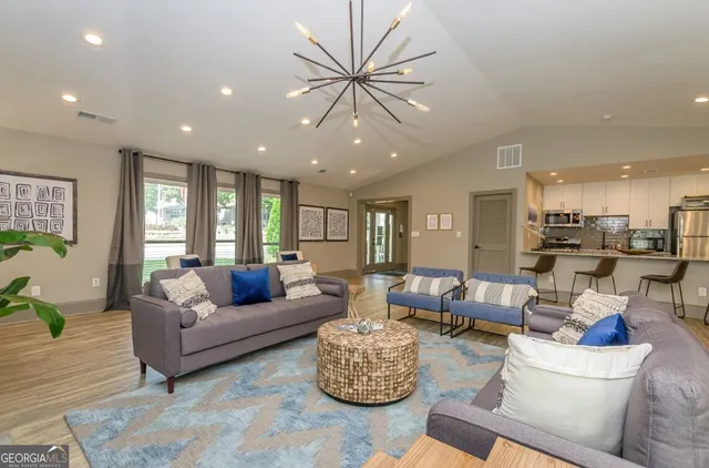 a living room with furniture and a large window
