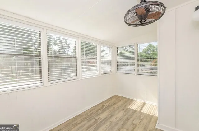 a view of an empty room with a window