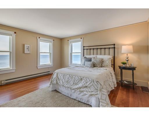 26 Rowley Shore Gloucester, MA 01930 - Photo 10 of 18 a bedroom with a bed window and a night stand