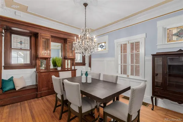 a view of a dining room with furniture window and wooden floor