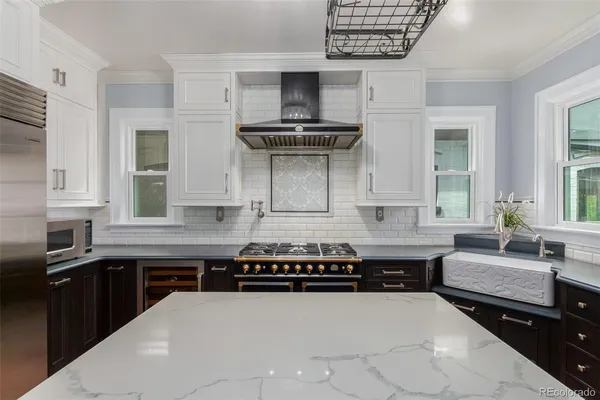 a kitchen with a stove and a sink