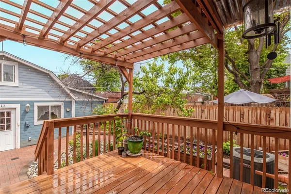 a view of a wooden deck with a yard