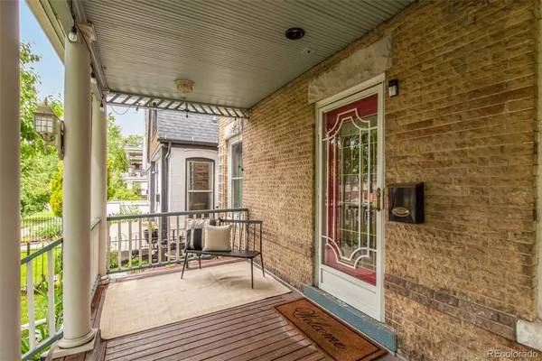 a view of a balcony with wooden floor