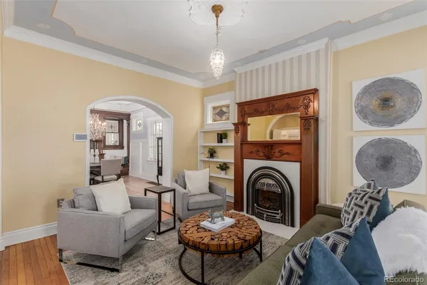 a living room with furniture and a fireplace