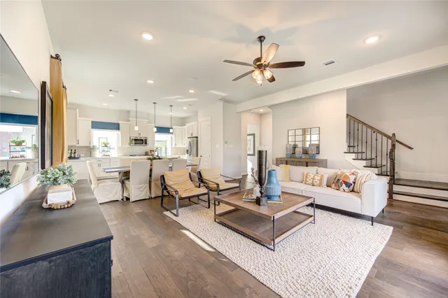 a large kitchen with a table and chairs