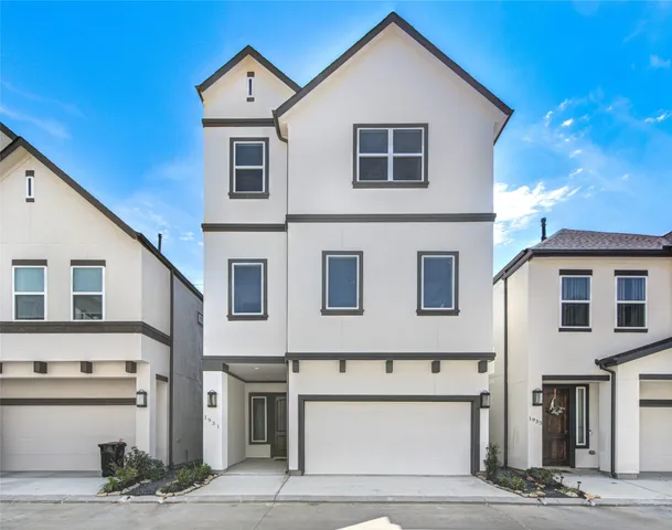 a view of an entryway with wooden floor and door