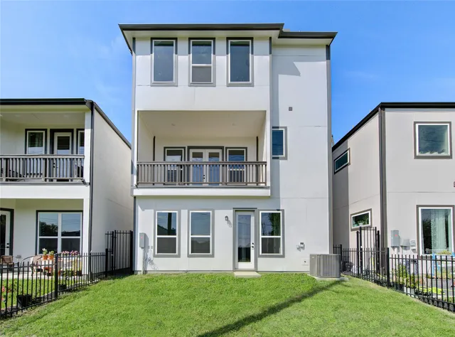 an aerial view of a residential apartment building with a yard