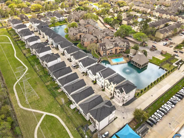 view of a swimming pool with a yard