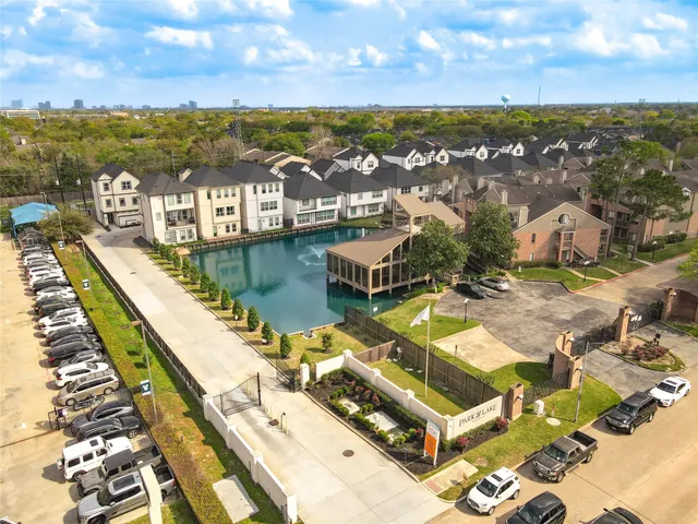 an aerial view of residential houses with outdoor space