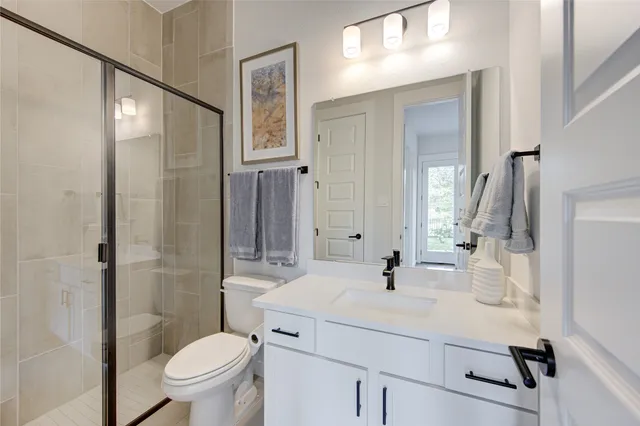 a living room with furniture a flat screen tv and a large window