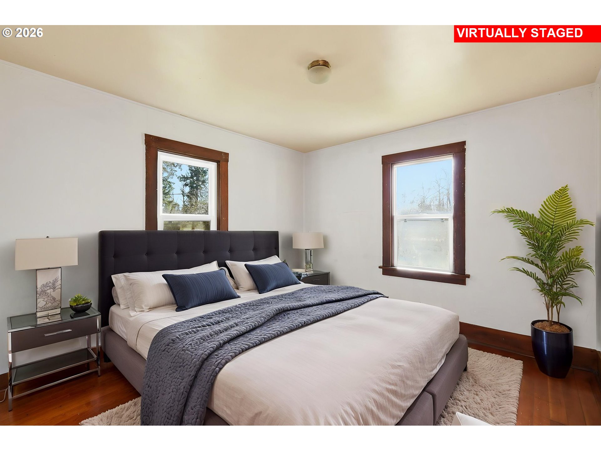 36725 Jasper Road Springfield, OR 97478 - Photo 12 of 46 a bedroom with a bed and a potted plant