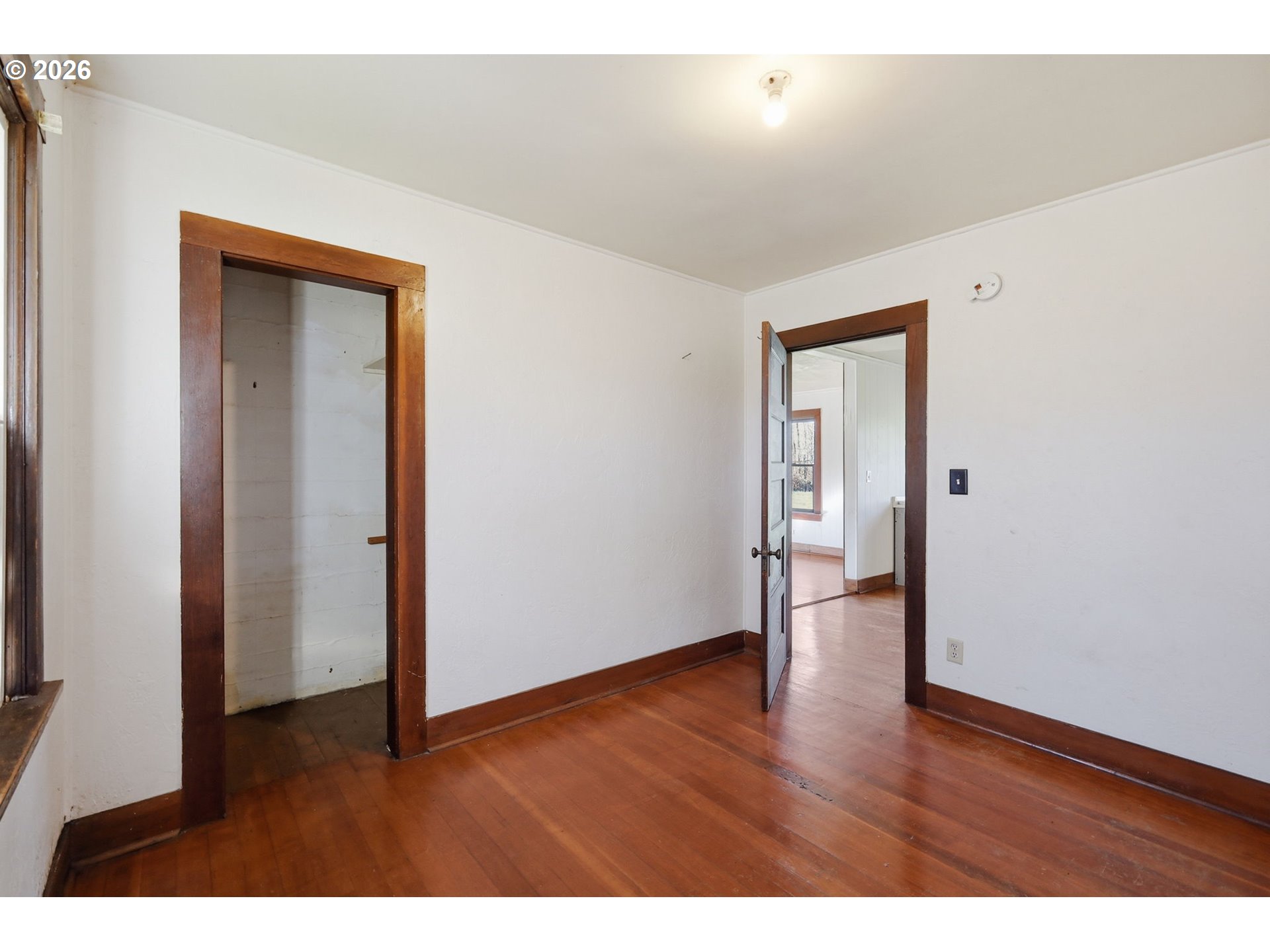 36725 Jasper Road Springfield, OR 97478 - Photo 15 of 46 a view of an empty room with wooden floor and closet