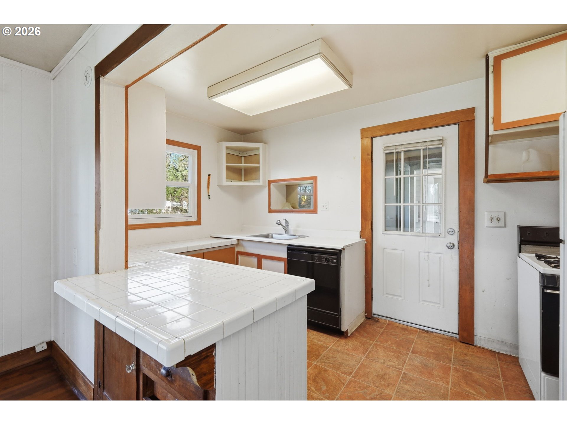 36725 Jasper Road Springfield, OR 97478 - Photo 16 of 46 a kitchen with a sink a counter top space and a window