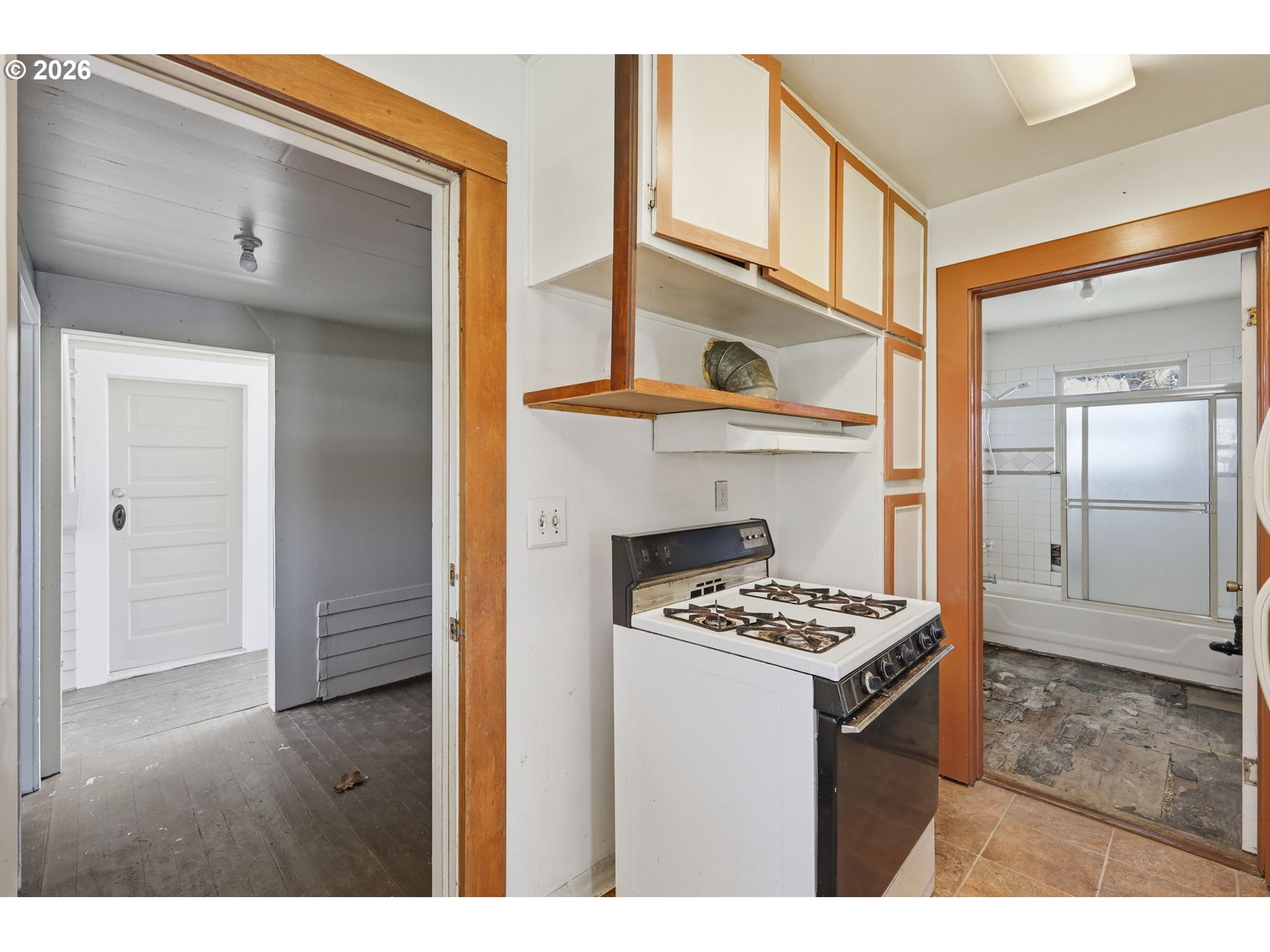 36725 Jasper Road Springfield, OR 97478 - Photo 21 of 46 a kitchen view with a stove a sink and a refrigerator with wooden floor