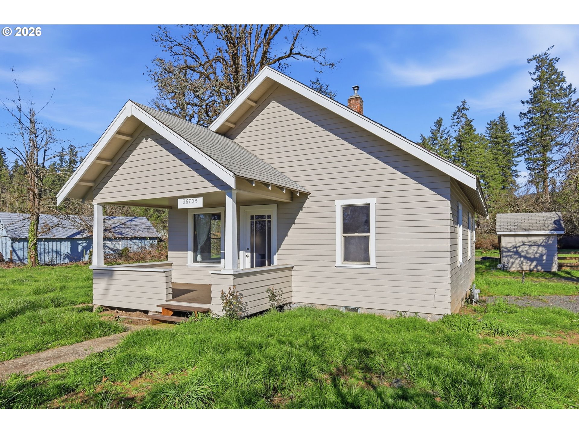 36725 Jasper Road Springfield, OR 97478 - Photo 3 of 46 a view of a house with a backyard