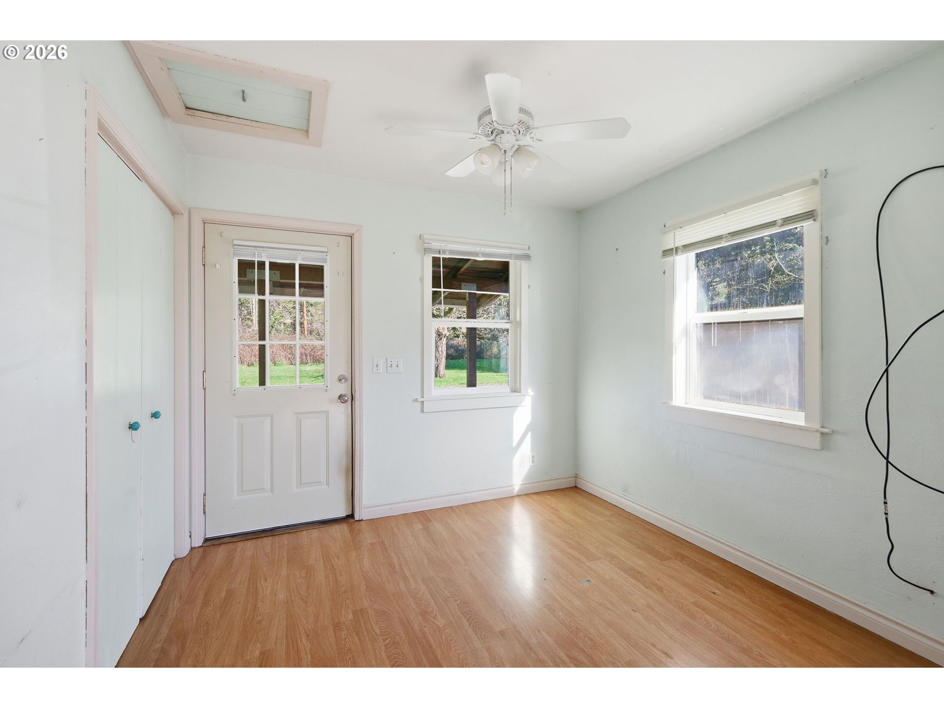 36725 Jasper Road Springfield, OR 97478 - Photo 34 of 46 a view of an empty room with a window and wooden floor
