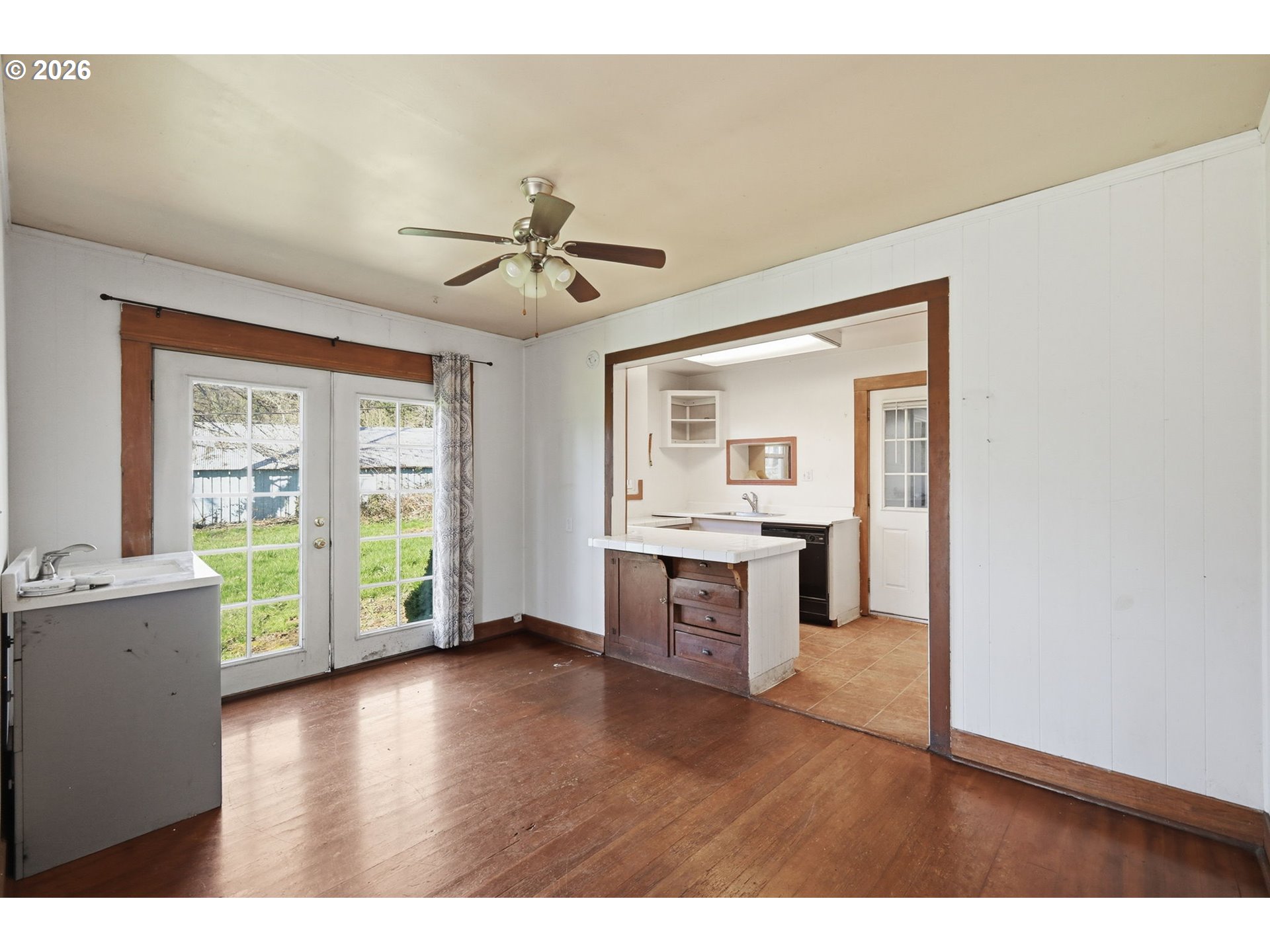 36725 Jasper Road Springfield, OR 97478 - Photo 8 of 46 a living room with stainless steel appliances kitchen island granite countertop a stove a sink a refrigerator with a dining table and chairs