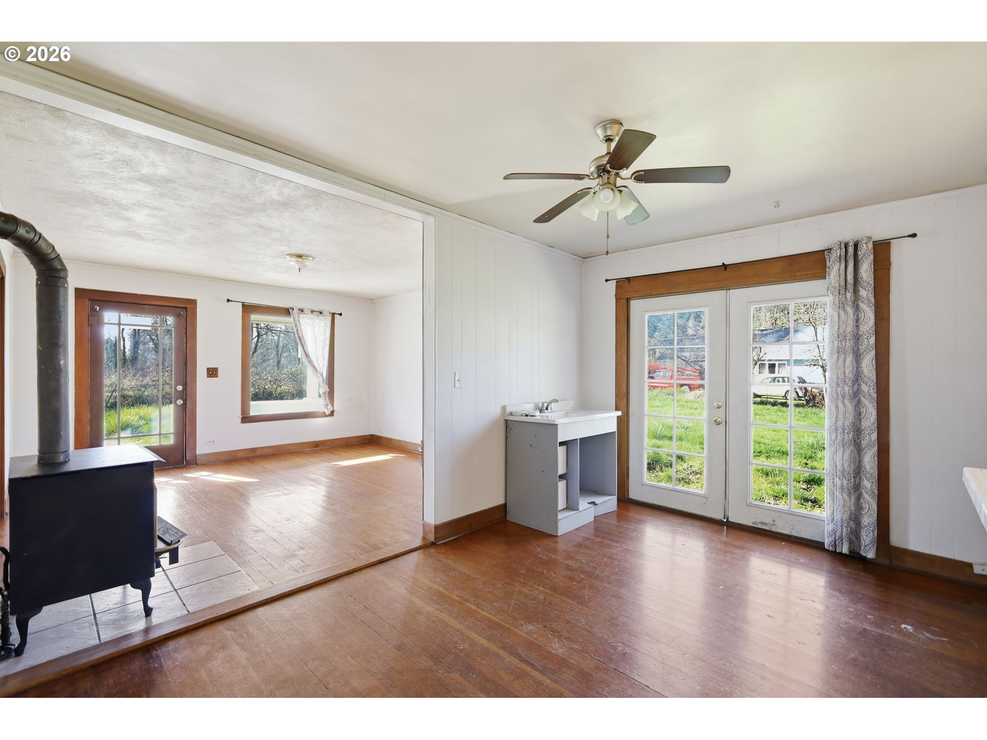 36725 Jasper Road Springfield, OR 97478 - Photo 10 of 46 a view of an empty room with a window and wooden floor