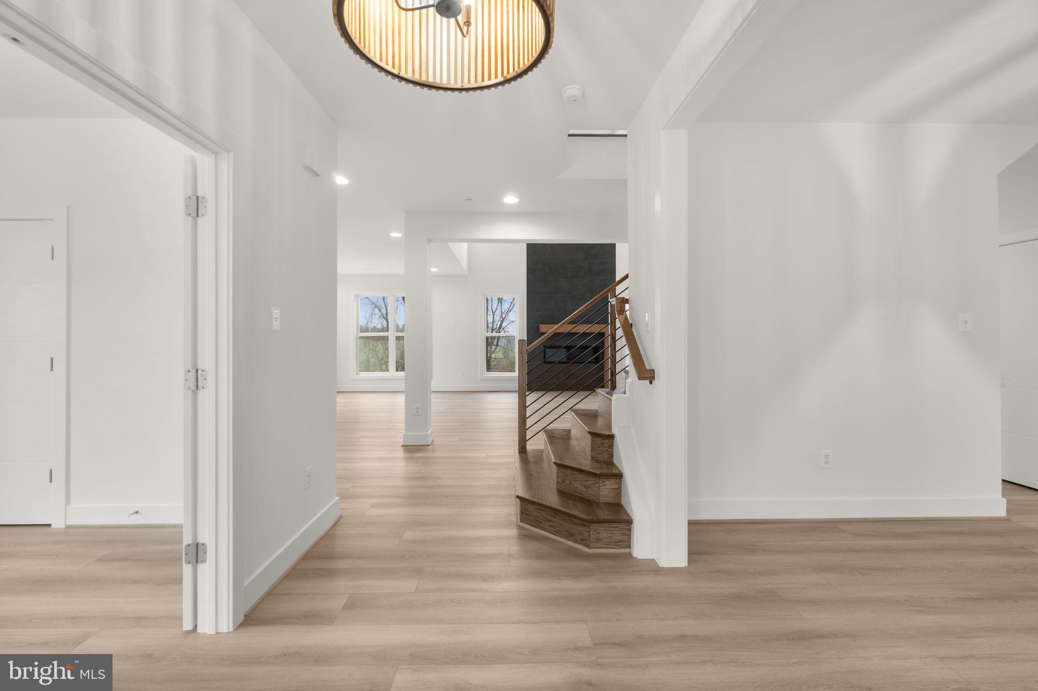 14628 Old Hanover Road, Unit BENTON Reisterstown, MD 21136 - Photo 2 of 69 a view of entryway and hall with wooden floor