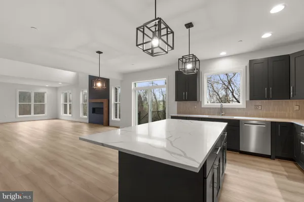 a stove top oven sitting inside of a kitchen