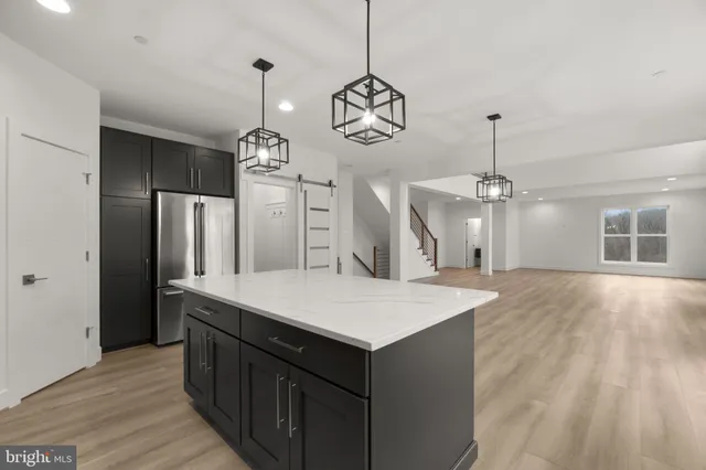 a view of a kitchen with a sink and cabinets
