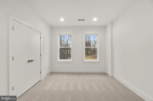 a view of an empty walk in closet