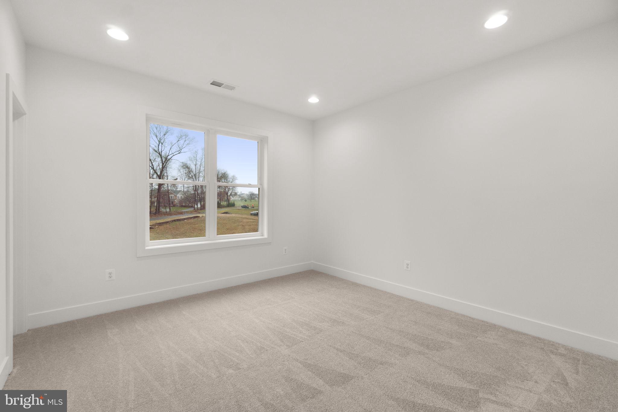 14628 Old Hanover Road, Unit BENTON Reisterstown, MD 21136 - Photo 39 of 69 a view of an empty room with a window